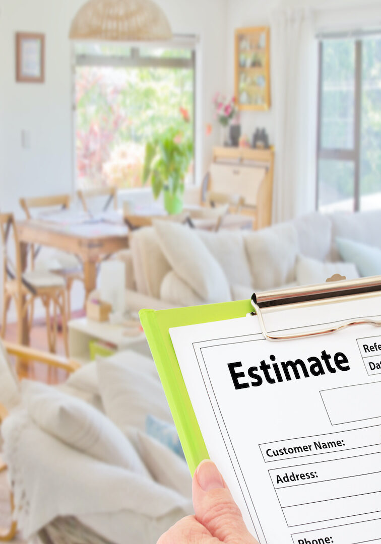 Hand writing an estimate on a clipboard to renovate home improvements concept